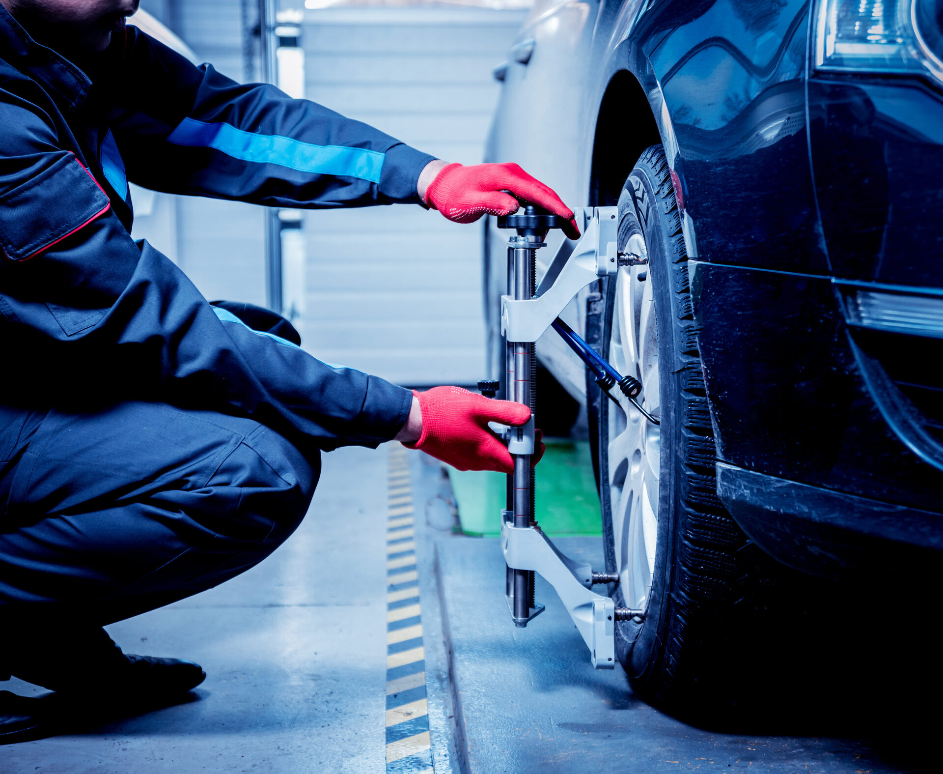Technician aligning a sensor target during ADAS calibration