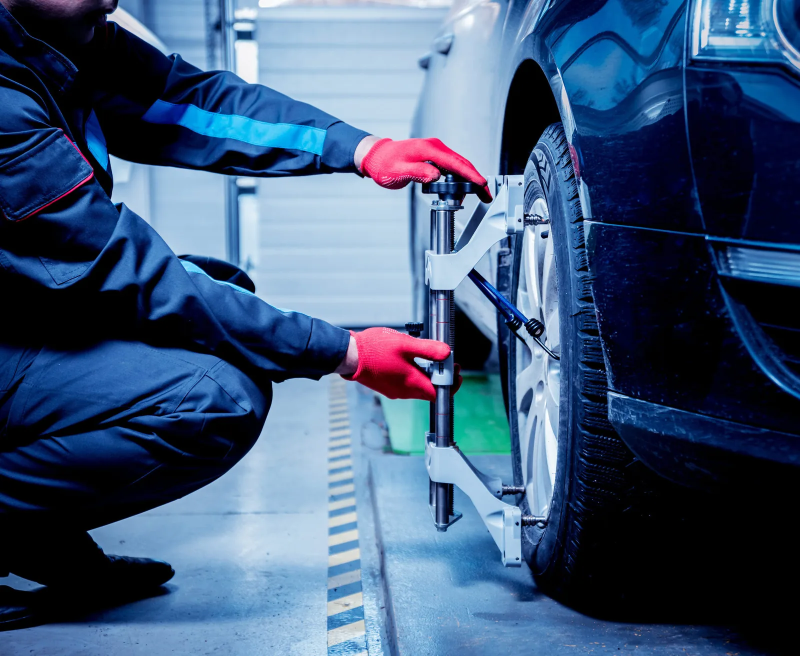 Technician aligning a sensor target during ADAS calibration